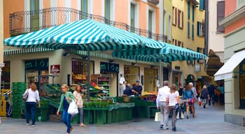 Lugano showing markets and street scenes as well as a small group of people