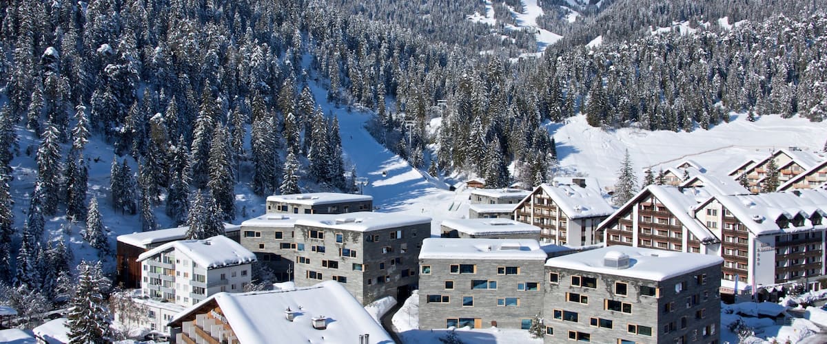 Flims which includes snow, landscape views and a small town or village