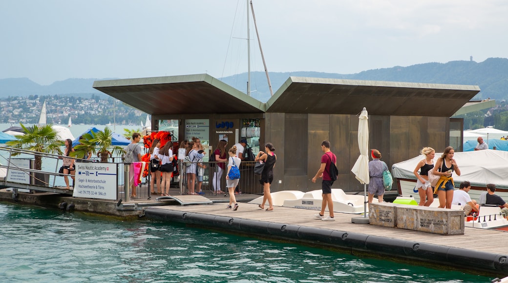 Lakeside Promenade showing a bay or harbor as well as a small group of people