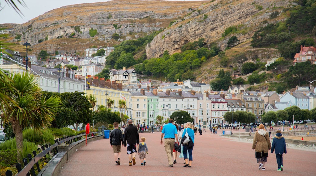 Promenade featuring a small town or village as well as a small group of people