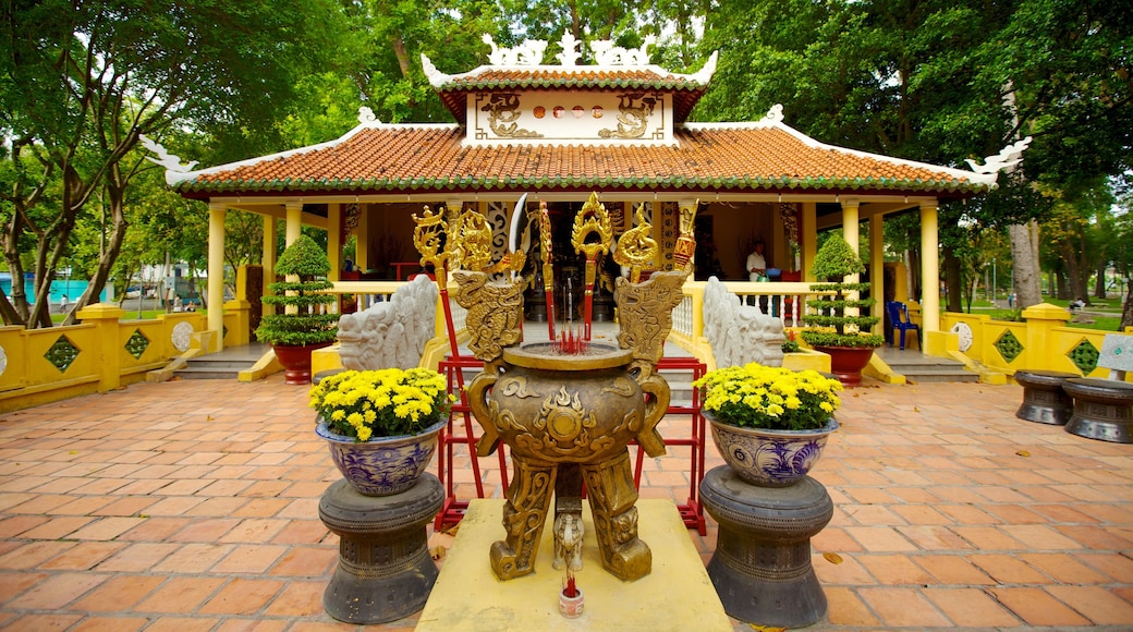 Tao Dan Park which includes a garden, a temple or place of worship and religious aspects