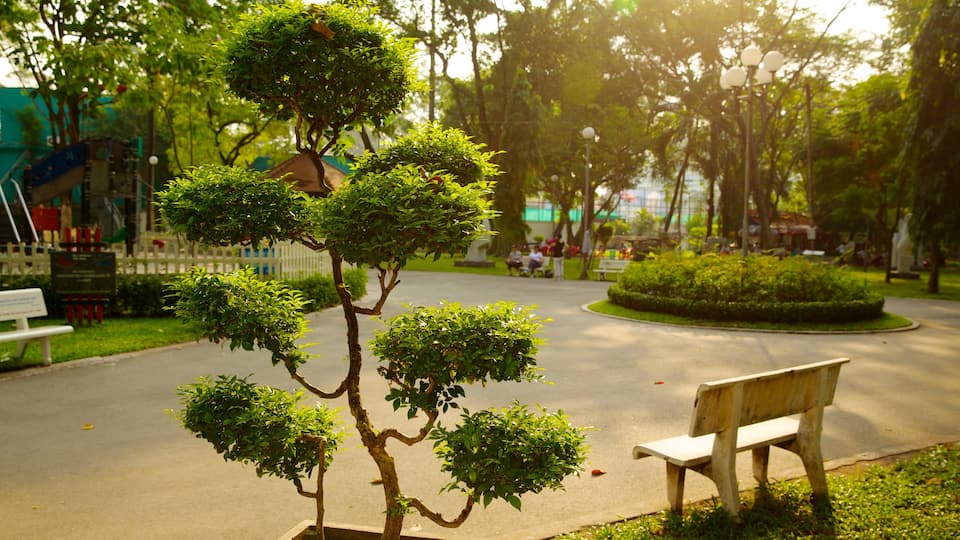 Tao Dan Park showing a sunset, a garden and interior views