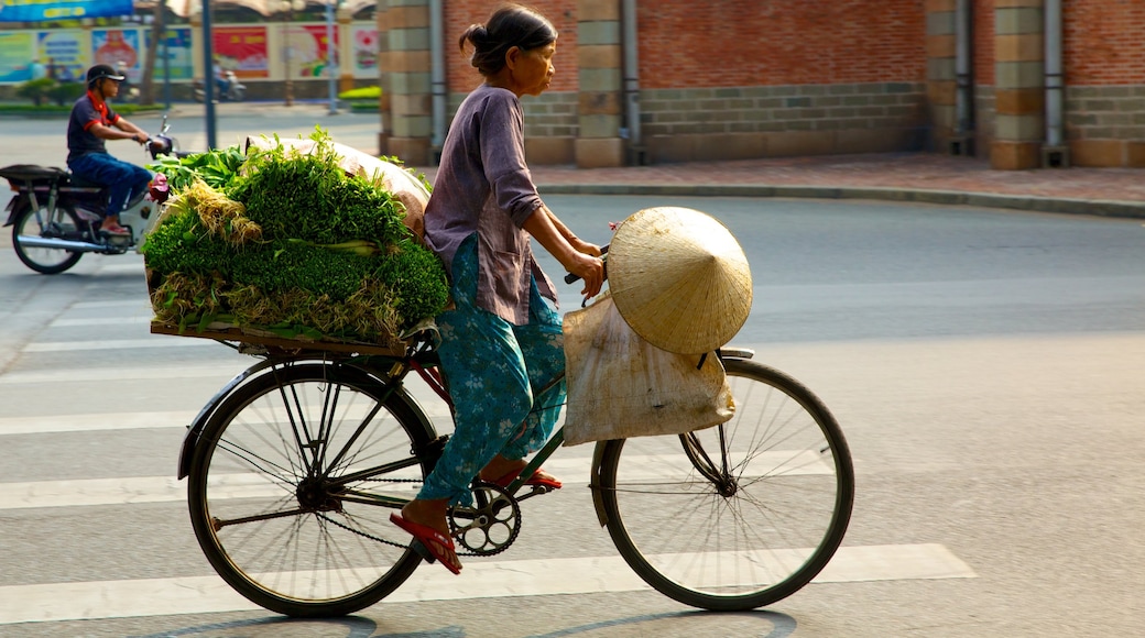 Ho Chi Minh City Notre Dame Cathedral featuring street scenes, cycling and a city