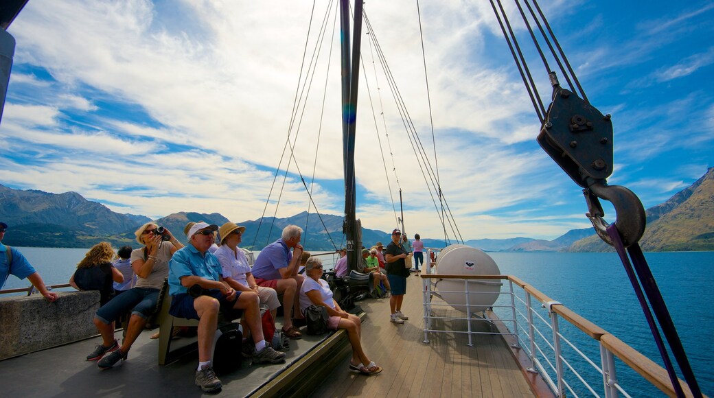 TSS Earnslaw Steamship showing boating and mountains as well as a large group of people