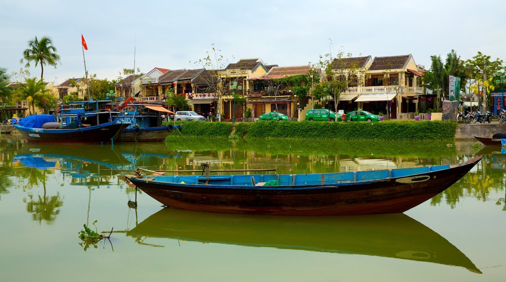 Hoi An Ancient Town showing a house, a river or creek and boating