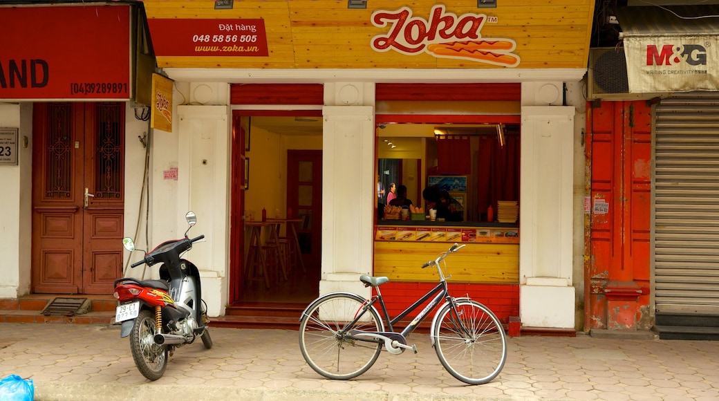 Hoan Kiem featuring street scenes and signage