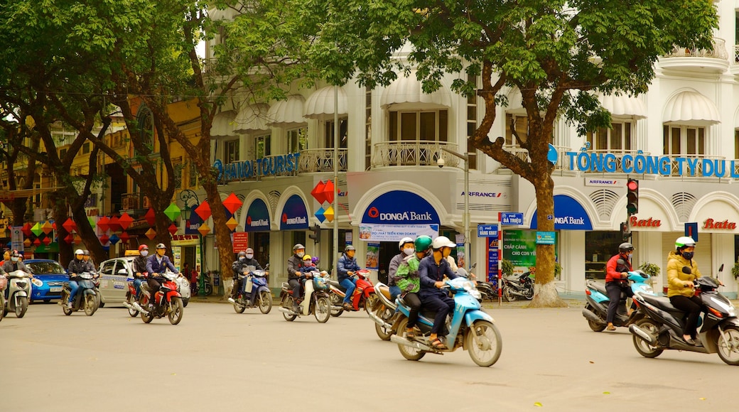 Old Quarter - Hoan Kiem Lake featuring motorbike riding, street scenes and a city