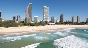 Broadbeach which includes a sandy beach, a high-rise building and skyline