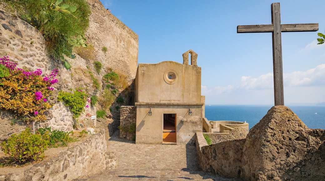 Aragonese Castle which includes general coastal views, heritage elements and religious elements