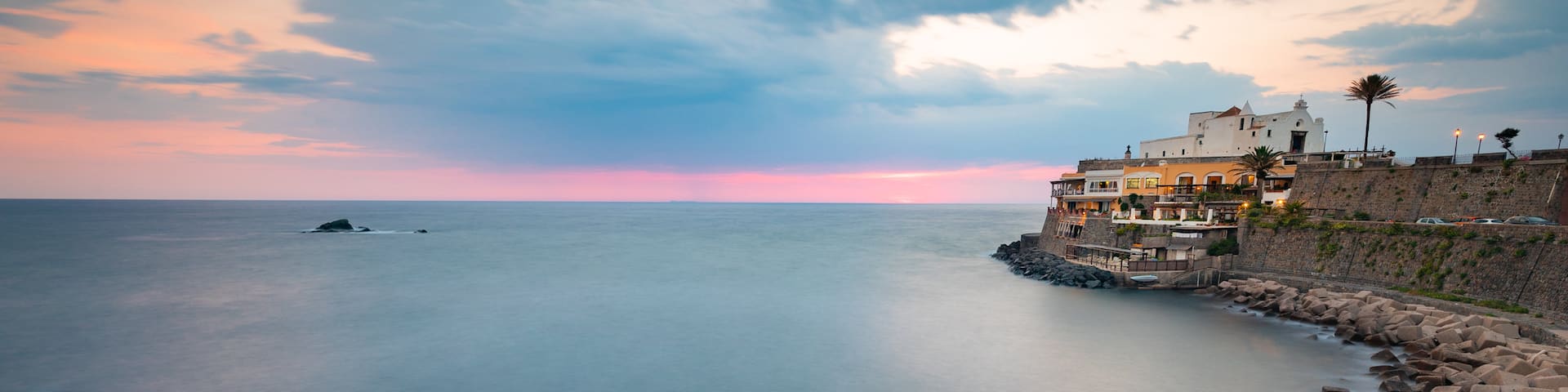 Soccorso Church which includes a sunset, landscape views and general coastal views