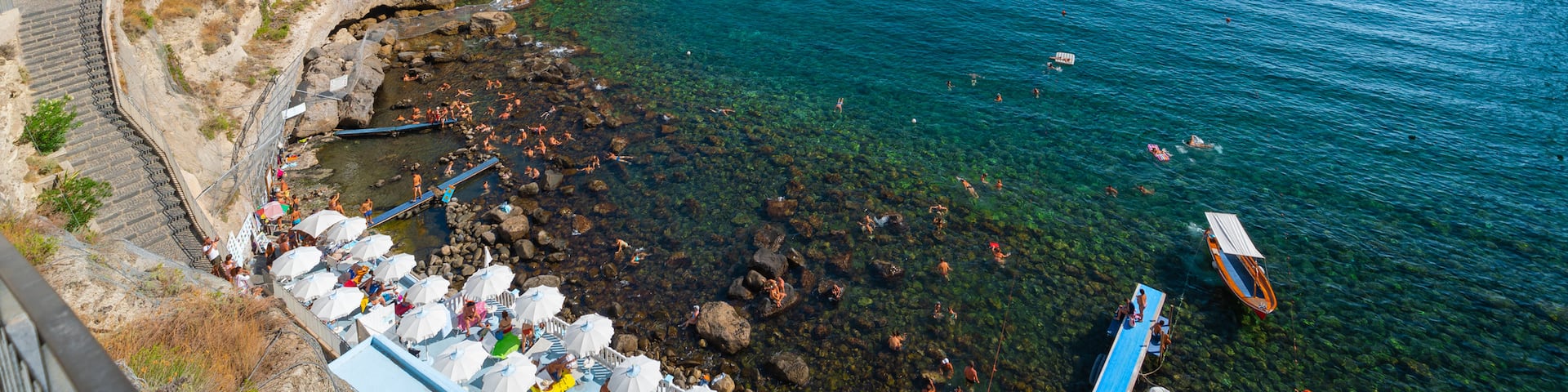 Bay of Sorgeto which includes general coastal views, rugged coastline and landscape views