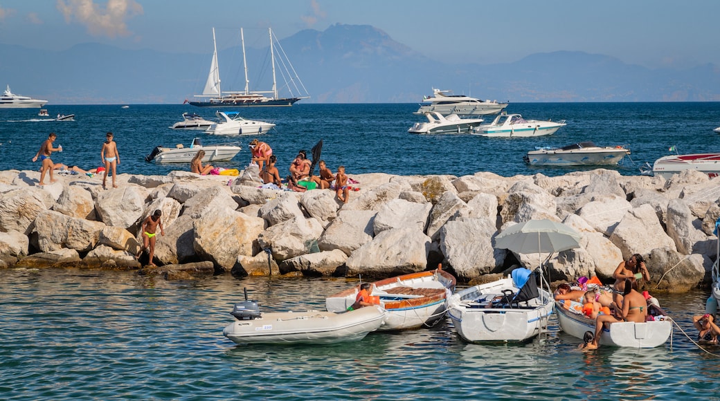 Via Caracciolo e Lungomare di Napoli featuring a bay or harbor and general coastal views as well as a small group of people