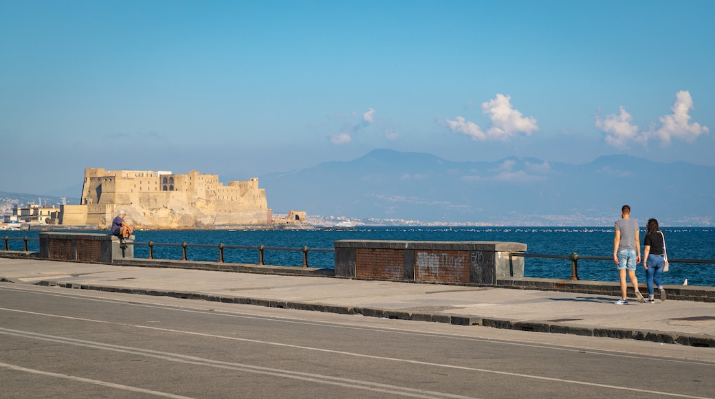 Via Caracciolo e Lungomare di Napoli featuring general coastal views and heritage elements as well as a couple