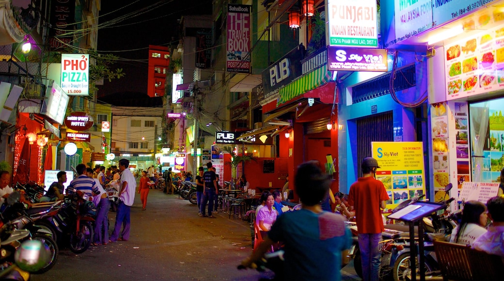 Ho Chi Minh City which includes night scenes, street scenes and signage