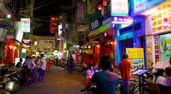 Ho Chi Minh City showing markets, signage and night scenes