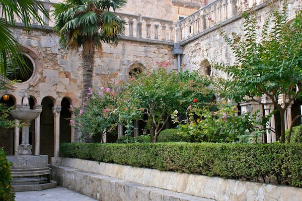 Rector\'s Palace showing a garden, heritage architecture and a castle