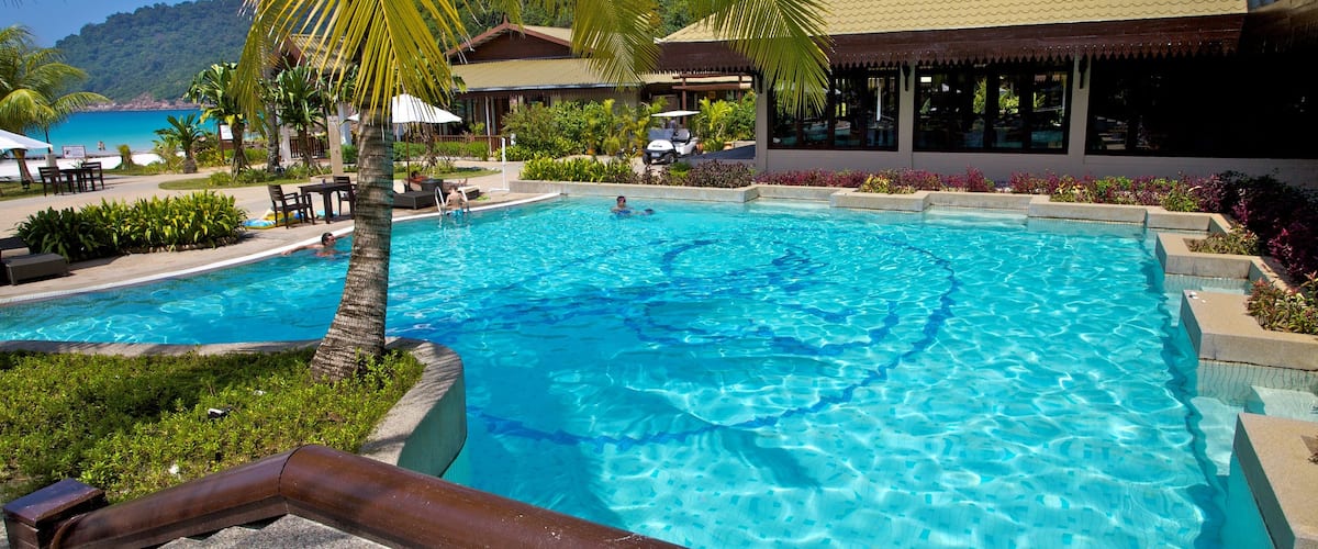 Redang Island which includes a luxury hotel or resort, swimming and tropical scenes