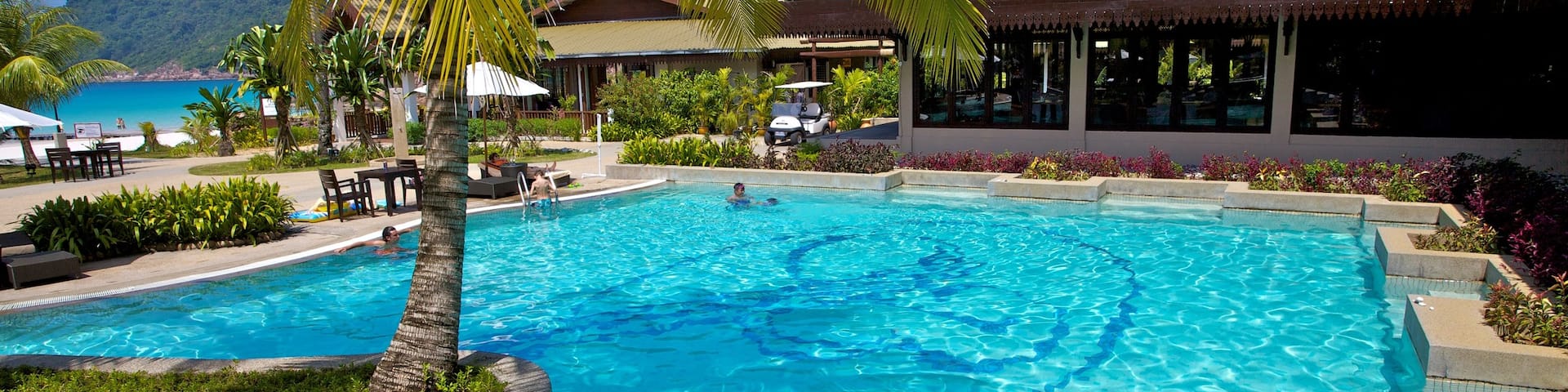 Redang Island featuring a pool, tropical scenes and a luxury hotel or resort