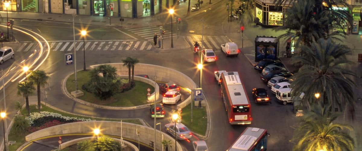 Plaza de la Reina featuring modern architecture, a city and street scenes