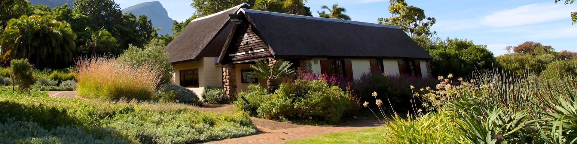 Kirstenbosch National Botanical Garden which includes tranquil scenes, a garden and a house