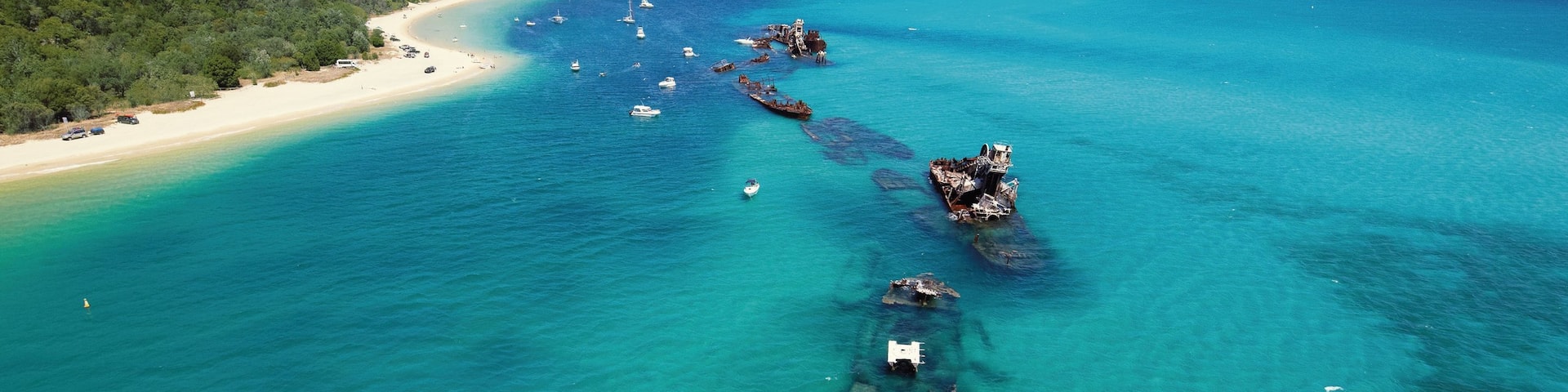 Tangalooma welches beinhaltet allgemeine KĂŒstenansicht, Strand und tropische Szenerien