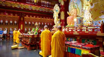 Chinatown showing a temple or place of worship, interior views and religious elements