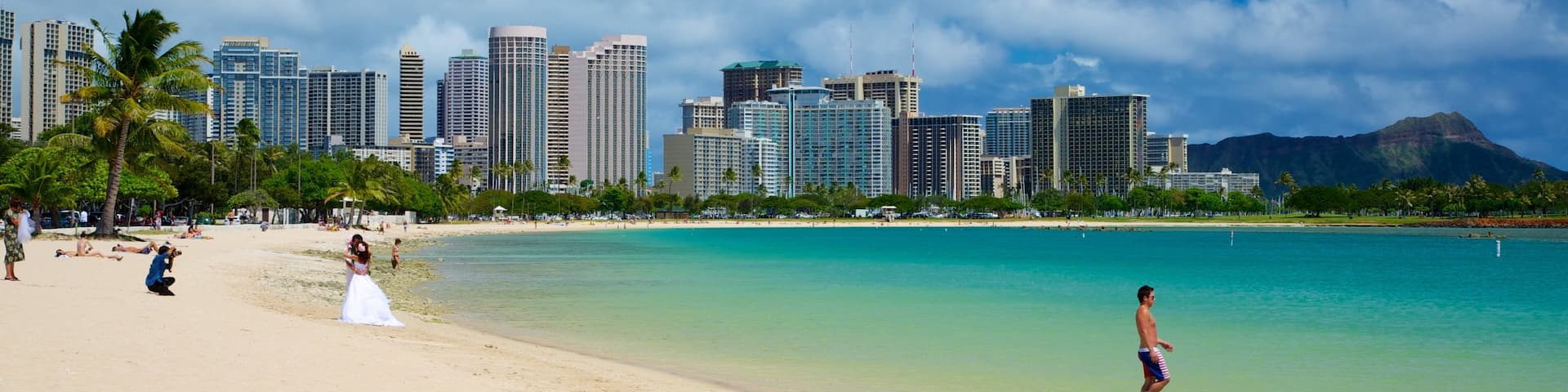 Ala Moana Beach Park featuring a coastal town, tropical scenes and modern architecture