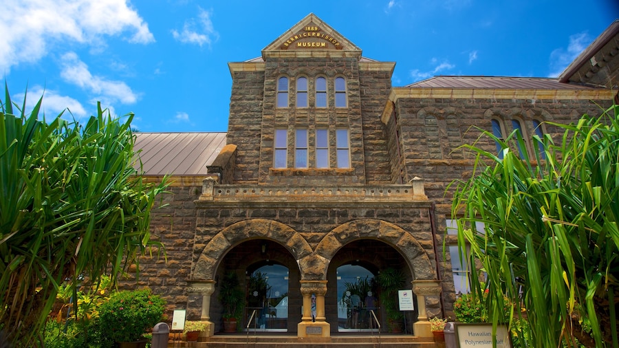 Exterior view of the Bishop Museum in Honolulu, Hawaii, showcasing its historic architecture.