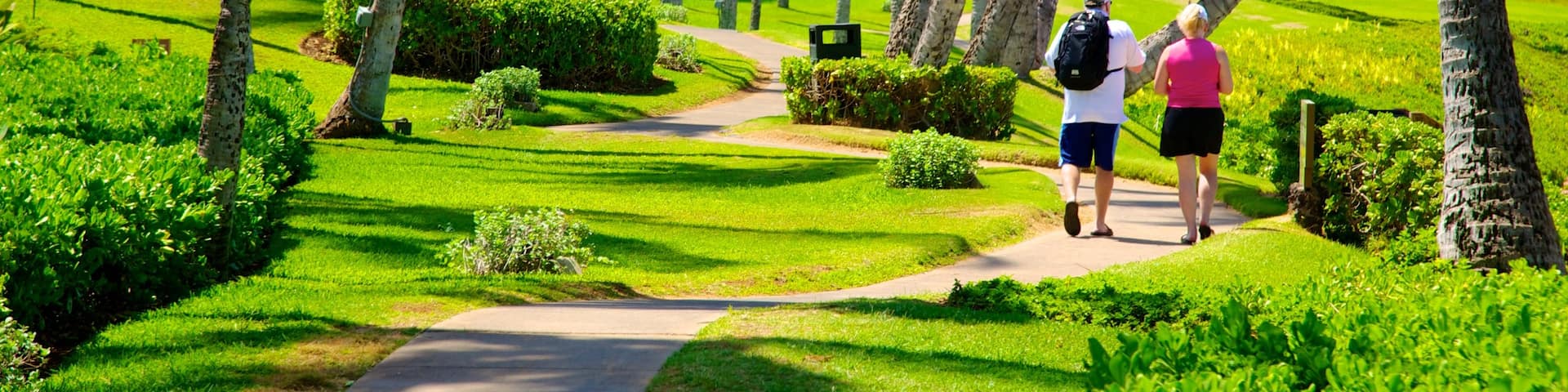 Wailea Beach featuring a garden and tropical scenes as well as a couple
