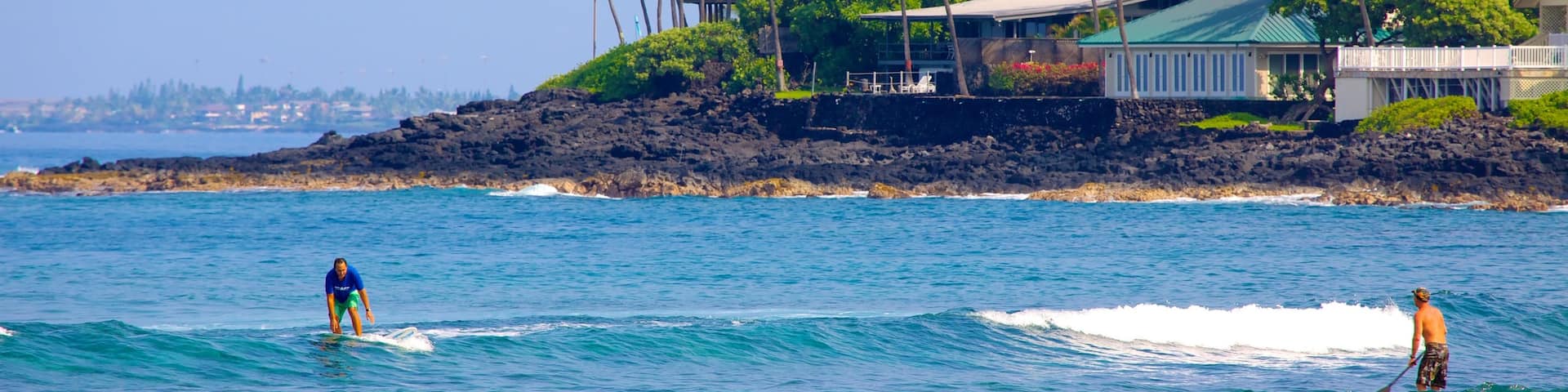 Kahalu\'u Beach Park featuring rugged coastline, a coastal town and tropical scenes