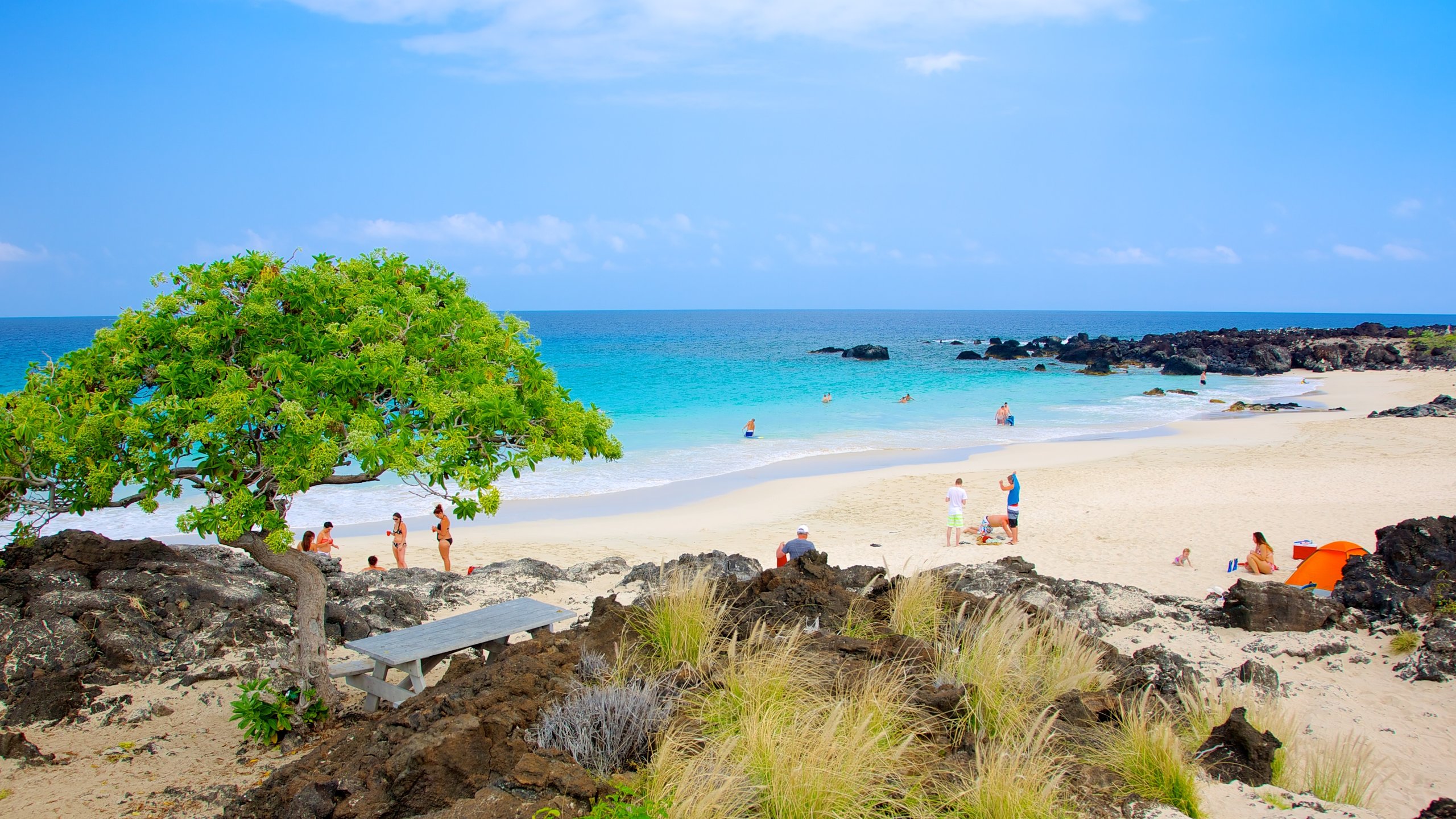 Kua Bay showing a sandy beach and a coastal town