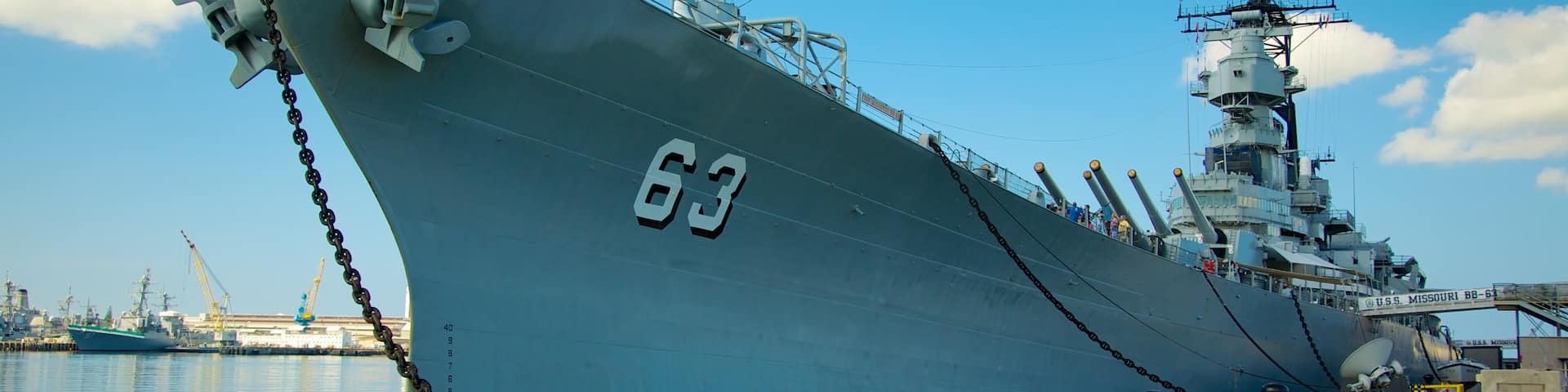 USS Missouri Memorial featuring military items, a bay or harbor and a marina