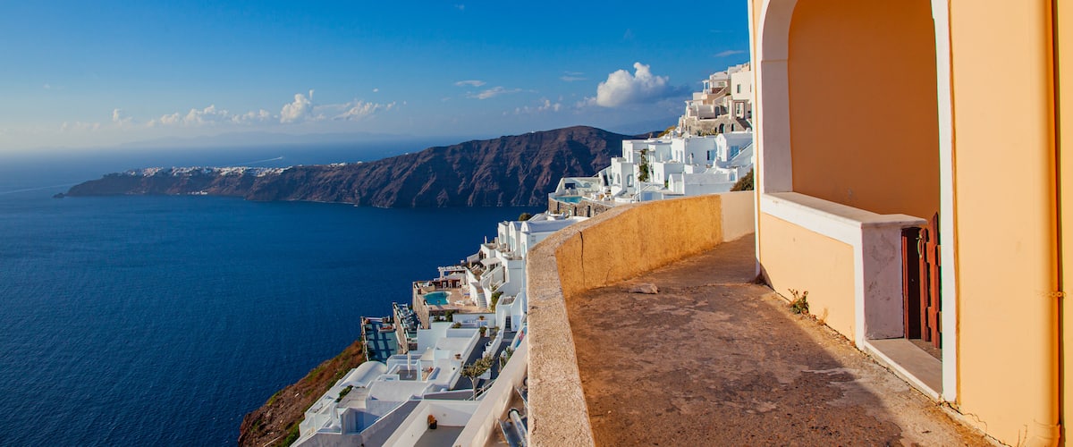 Santorini which includes a coastal town and general coastal views