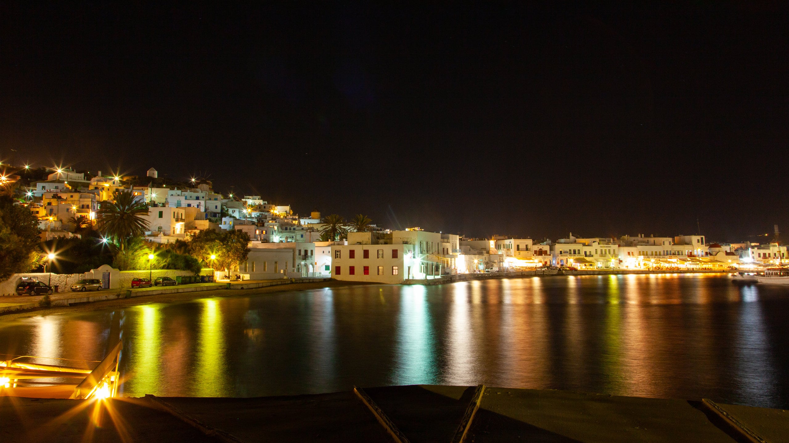Mykonos Town which includes a bay or harbor, night scenes and a coastal town