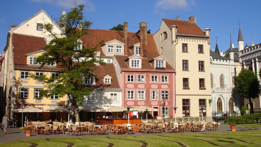 Riga showing a square or plaza, outdoor eating and dining out