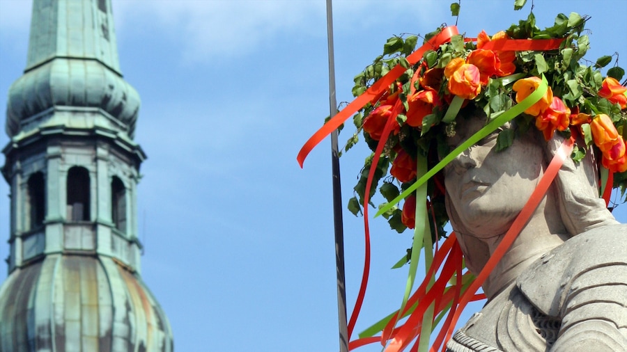 Latvia featuring outdoor art, heritage architecture and flowers