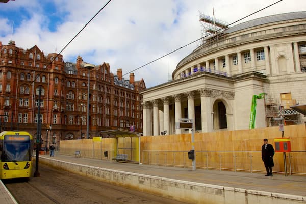 St. Peter\'s Square showing a city and heritage architecture as well as an individual male