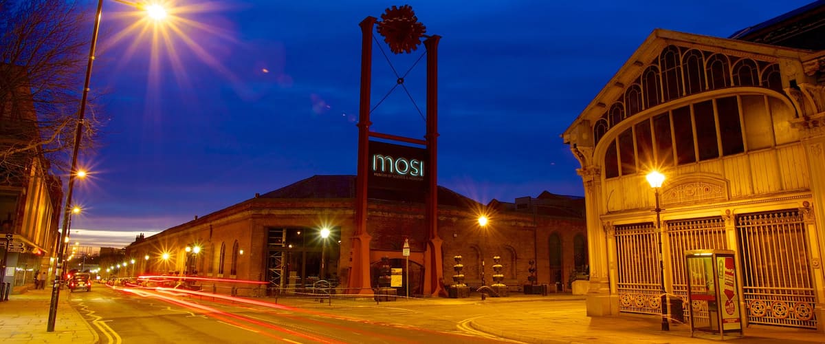 Museum of Science and Industry featuring a sunset, night scenes and a city