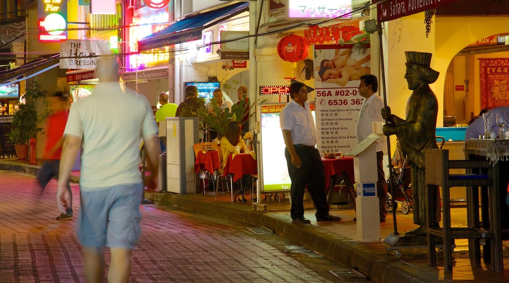 Boat Quay which includes night scenes, street scenes and dining out