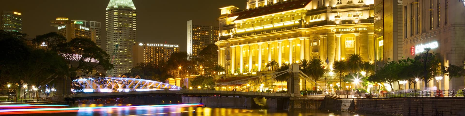 Boat Quay which includes a city, a bridge and night scenes
