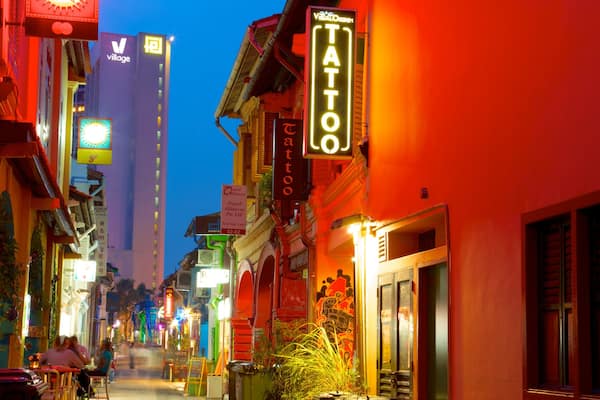 Haji Lane which includes night scenes, a city and signage