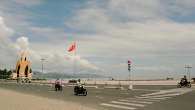 Nha Trang featuring motorbike riding, a coastal town and street scenes