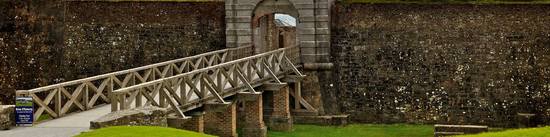 Charles Fort which includes a bridge, tranquil scenes and heritage architecture
