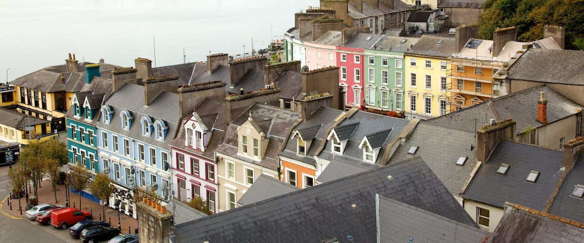 Cobh featuring heritage architecture, a bay or harbor and a coastal town