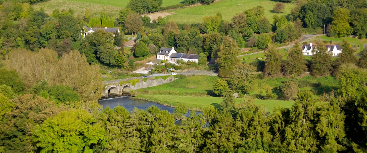 Ireland showing farmland, tranquil scenes and a small town or village