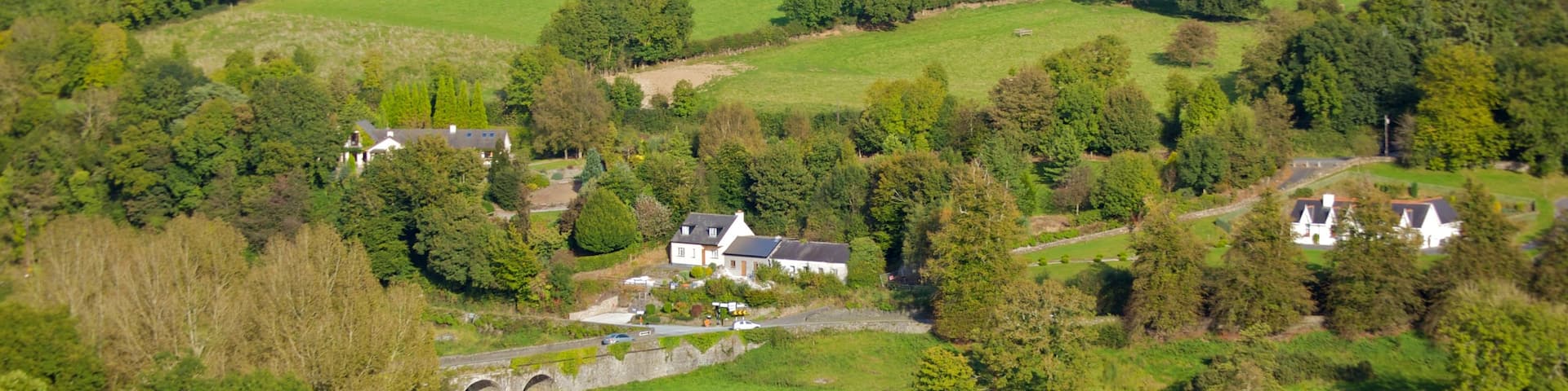 Ireland featuring landscape views, a small town or village and forests
