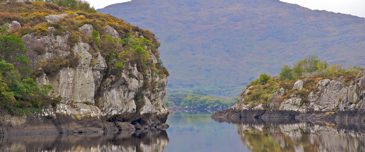 Killarney which includes mountains, landscape views and a river or creek