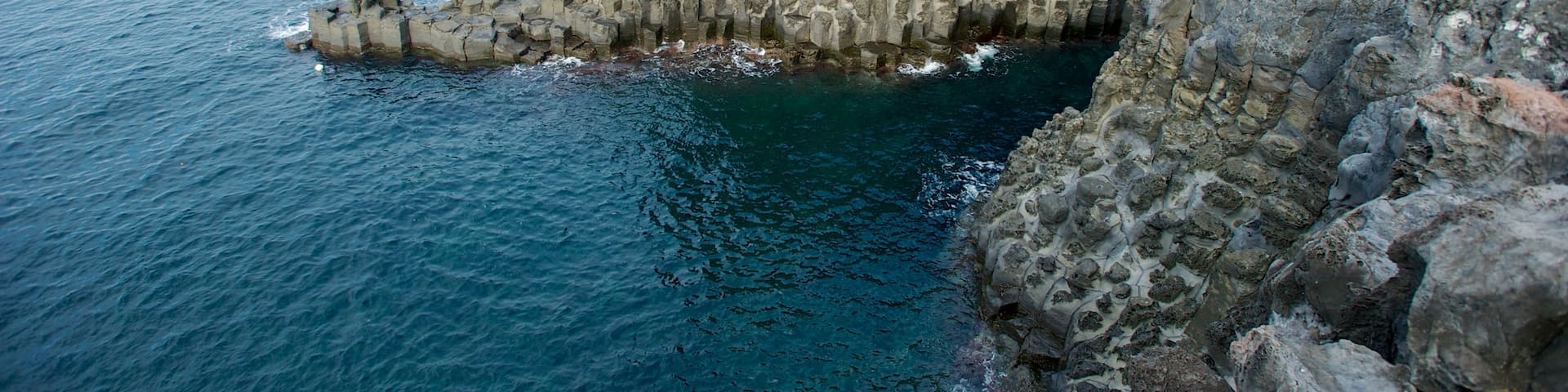 Jeju Island showing rugged coastline, landscape views and mountains