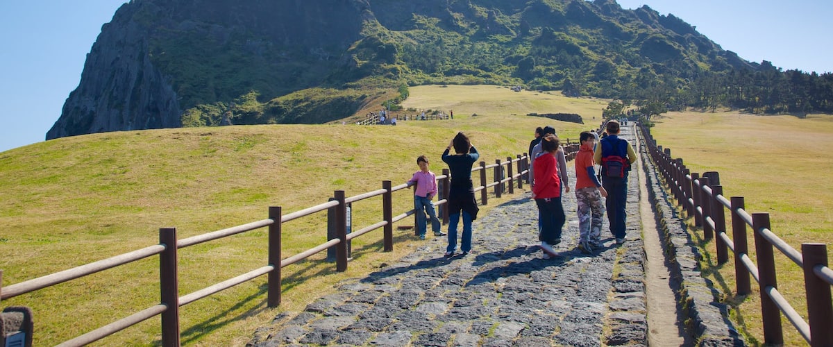Seongsan Ilchulbong featuring landscape views, hiking or walking and tranquil scenes