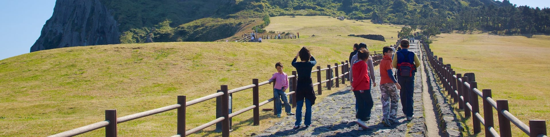Seongsan Ilchulbong featuring landscape views, hiking or walking and tranquil scenes